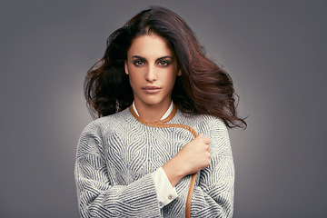 Image showing Style, beauty and portrait of woman in studio with classy, trendy and stylish outfit for confidence. Serious, makeup and female person with elegant fashion and accessory isolated by gray background.