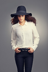 Image showing Fashion, cosmetic and portrait of woman in studio with classy, trendy and stylish hat for outfit. Confident, makeup and female person with elegant style and accessory isolated by gray background.
