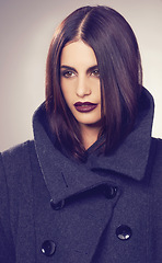 Image showing Coat, winter fashion or woman in studio thinking of a cool, trendy jacket or comfortable outfit. Face, makeup or serious model with satisfaction in cosy, style or casual clothing on grey background