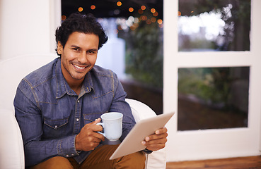 Image showing Man, smile and portrait with tablet for internet, online and social media for streaming and relax in house. Arab person or blogger with tech and coffee for web on sofa in living room for break