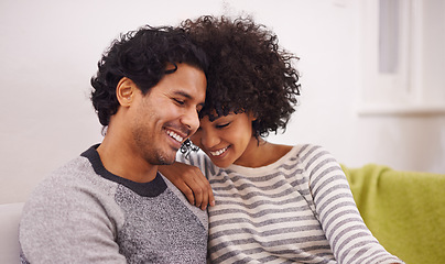 Image showing Couple, couch and touch for care and love in home, smile and proud of marriage and commitment. Happy people, affection and relax on sofa in living room on weekend, support and trust in relationship