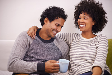 Image showing Couple, couch and hug for care and coffee in home, smile and proud of marriage and commitment. Happy people, embrace and laughing on sofa in living room on weekend, support and trust in relationship