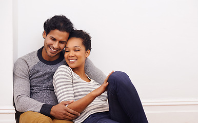 Image showing Couple, floor and hug for care and love in home, smile and proud of marriage and commitment. People, affection and embrace in living room on weekend, support and trust or bonding in relationship