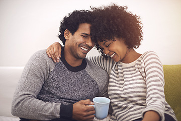Image showing Couple, couch and hug for care and tea in home, smile and proud of marriage and commitment. Happy people, embrace and laughing on sofa in living room on weekend, support and trust in relationship