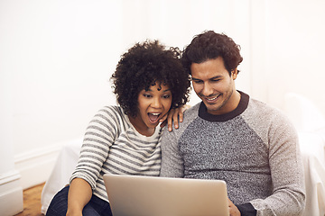 Image showing Couple, laptop and living room with lounge, smile and love for home or house date. Man, woman and technology for surprise, shock and social media for bonding and happy relationship or marriage