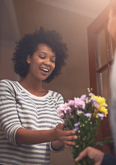 Image showing Happy, flowers and woman with man by door for anniversary or romantic gift at apartment. Smile, love and young female person receiving bouquet of pink floral plants for surprise at modern home.
