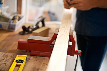 Image showing Carpentry, craft and workbench with wood for home improvement, building renovation and woodwork in garage. Lumber, construction and person for diy, furniture restoration or manufacturing on project