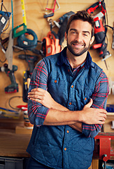 Image showing Man, tools and portrait in workshop or garage for diy, repair and maintenance for job, skill or tradesman. Artisan, handyman or carpenter with smile and confident with equipment for repairs indoor