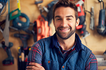 Image showing Carpenter, portrait and happy man in workshop for diy, home development or building renovation. Handyman, tools and male employee for maintenance, equipment and repair work for construction in garage