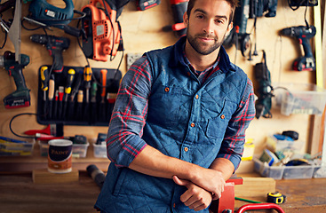 Image showing Tools, diy and portrait of man in workshop for home development, carpentry and building renovation. Confidence, male employee and contractor for maintenance, equipment and repair work in garage