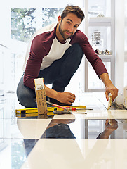 Image showing Renovation, construction and portrait of man for remodel, home improvement and diy project. Tools, tiling and male employee with equipment for handyman, worker and maintenance service in house