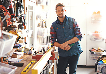 Image showing Carpenter, woodwork and portrait of man in workshop for home development, diy tools and building renovation. Smiling, male employee and contractor for maintenance, equipment and repair work in garage