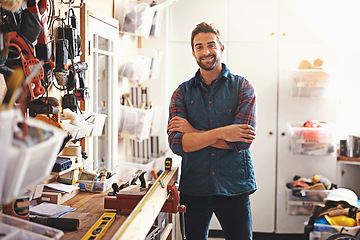 Image showing Tools, smile and portrait of man in workshop for furniture, manufacturing and small business production. Male person, happy and handyman with equipment for renovation, maintenance or remodeling