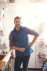 Image showing Carpentry, wood and portrait of man in garage for home development, diy tools and building renovation. Smiling, lens flare and happy male employee with maintenance, equipment and design project