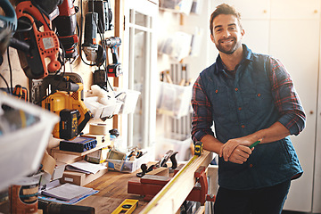 Image showing Carpenter, wood and portrait of happy man in workshop for home development, diy tools and building renovation. Smiling, male employee and contractor for maintenance, equipment and repair work