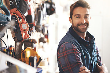 Image showing Happy, carpenter and portrait of man in workshop for production, manufacturing or creative small business. Male person, tools and handyman with equipment for renovation, remodeling or maintenance