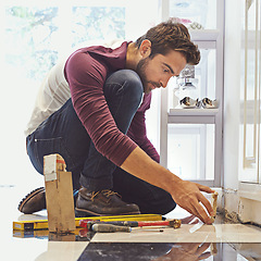 Image showing Diy, tiles and building construction man for restoration, home improvement and project. Tools, development and male employee with equipment for handyman, builder and maintenance service in house