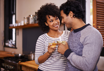 Image showing Couple, wine and cheers for love, romance and passion for romantic, dating and relationship together. Boyfriend, girlfriend and young people for interracial pair for happy and drink in kitchen