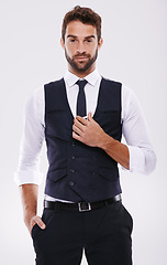 Image showing Man, fashion and portrait in studio with tuxedo or suit and isolated for trendy, style and classy. Young person, smile and handsome for formal clothes with shirt and tie for designer wear and alone