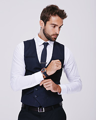 Image showing Studio, confident and man in suit for fashion, stylish and luxury for aesthetic of glamour and classic. Adult, guy and male person in white background, tuxedo and professional for job and career