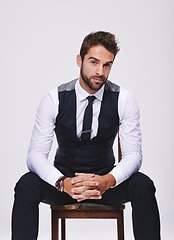 Image showing Man, fashion and portrait in studio with tuxedo or suit and isolated for trendy, style and classy. Young person, serious and handsome for formal clothes with shirt and tie for designer wear and alone