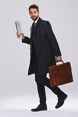 Image showing Businessman, briefcase and career walking in studio for employee commute, white background or mockup space. Male person, newspaper and journalist reporter for international news, article or new job