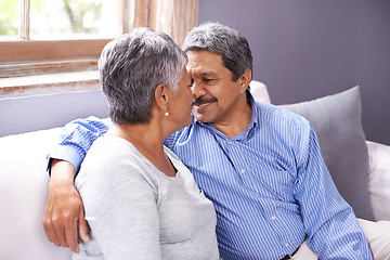 Image showing Love, embrace and elderly couple in living room with smile for love, care and romance at home. Retirement, relax and senior people with happiness for bonding, satisfaction and support on sofa