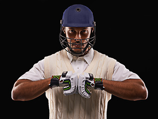 Image showing Man, portrait and cricket player with sports gloves in studio for professional competition, training or exercise. Male person, face and protection on black background, pitch gear or mockup space