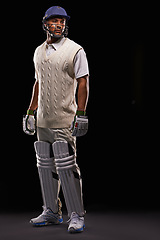 Image showing Man, cricket and athlete for sports game in studio for professional match, competition or black background. Male person, gear and helmet with mockup space or fitness training, performance or workout