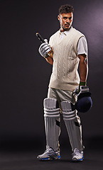 Image showing Man, portrait and cricket player with bat in studio for professional sports, competition or black background. Male person, face and match gear for workout confidence or practice, gloves or mockup