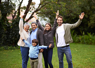 Image showing Portrait, smile and big family outdoor for freedom, celebration or laugh together at backyard. Park, happy and child with parents, grandparents and mother with interracial father at garden in nature