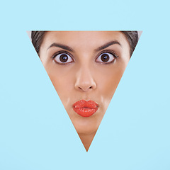 Image showing Face, woman and makeup or beauty in cutout and studio for cosmetics, skincare and dermatology with pout or surprise. Face of model or young person in foundation and triangle shape on blue background