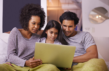 Image showing Family, girl and sofa with laptop to watch movie on online website for educational programs or child development. Parents, home and bonding with streaming cartoon in living room, learning and support