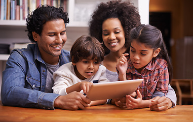 Image showing Family, children and table with tablet for educational games on online website for child development. Parents, home and siblings for bonding in living room with cartoons for learning and growth