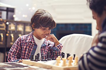 Image showing Child, father and chess game with thinking strategy or checkmate move with knight, king or queen. Son, parent and board for competition learn or decision thoughts for play, contest or problem solving