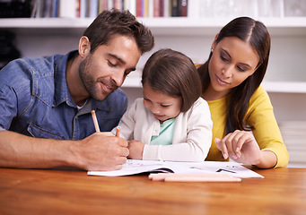 Image showing Mom, dad and child at table with homework for teaching, learning and support in education with love. Writing, drawing and parents with little daughter for help in homeschool, growth and development