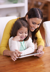 Image showing Happy, home and mother with girl, tablet and bonding together with movies and connection. Smile, family and mama with daughter or relax with technology or internet with social media or online cartoon