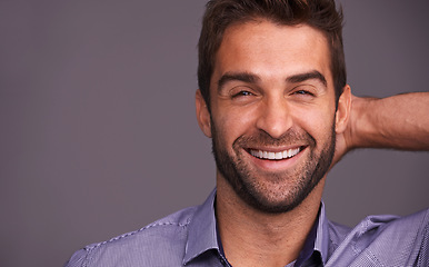 Image showing Studio, smile and portrait of man with confidence for good mood, pride and positivity on mockup. Cheerful, male person and face with happiness for satisfaction, joy and relax on gray background