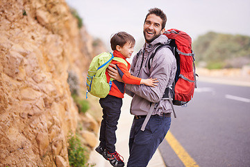 Image showing Father, child and portrait with hike, backpack and travel with smile and support in nature by road. Kid, adventure and laugh with love, trust and bonding together with family and journey for holiday