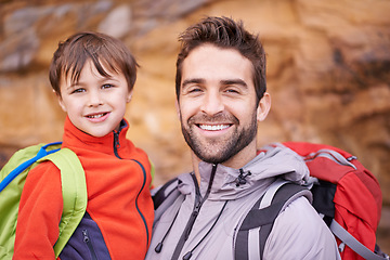 Image showing Father, child and portrait with hiking, backpack and travel with smile and support in nature. Kid, adventure and mountain with love, trust and bonding together with family and journey for holiday