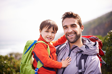 Image showing Dad, child and portrait with hiking, backpack and travel with smile and support in nature. Kid, adventure and mountain with love, trust and bonding together with family and journey for holiday