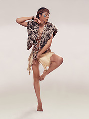Image showing Dance, woman and Native American culture in studio with warrior makeup, confidence and tribe style. Indigenous fashion, ceremony or girl in First Nations clothes on white background with energy