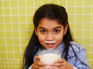 Image showing Milk, moustache or girl child portrait in house with healthy breakfast drink on yellow wall background. Protein, dairy and face of kid in india with milkshake for balance, energy or calcium nutrition