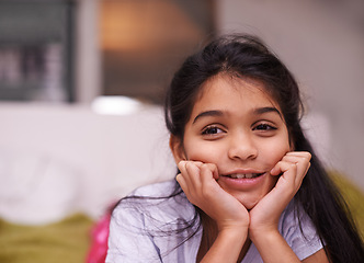 Image showing Thinking, face and girl child in a house with memory, reflection or planning, daydreaming or chilling. Idea, remember or calm kid in India brainstorming in a living room on weekend, vacation or break