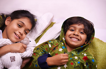 Image showing Family, children and portrait of siblings on a floor for camping, fantasy or night games in their home. Love, relax and face of kids on ground in India with support, trust and care, safety or resting