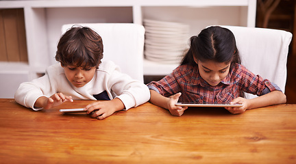 Image showing Tablet, search and kid siblings with phone in a kitchen for google it, gaming or bonding at home. Family, subscription and children in a house with online service, sign up or vacation entertainment