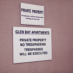 Image showing Trespassing, warning and sign on apartment of property for caution, notification and information. Public signage, symbol and private building with board, poster and mistake for attention or safety