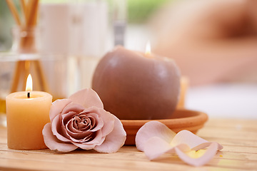 Image showing Closeup of candles, rose and holistic healing at spa for aromatherapy, wellness and treatment for self care. Detox, stress relief and energy balance for aura with tools, luxury and natural with zen