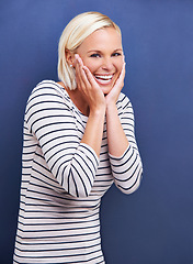 Image showing Happy, woman and portrait with confidence in fashion, style or creativity in studio on blue background. Girl, laughing and smile with pride as professional art director in business for project