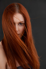Image showing Woman, portrait and hair care for beauty in studio with soft texture, keratin treatment and cosmetics glow. Model, face and redhead with salon hairstyle, shampoo growth or results on black background